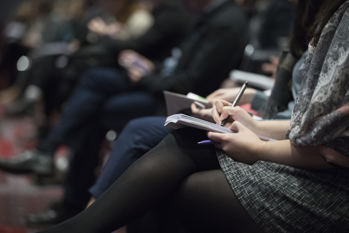 Learner taking notes during a professional procurement-focused session