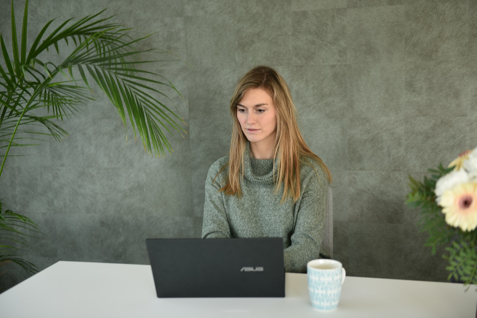 Learner working at a laptop in a quiet study space